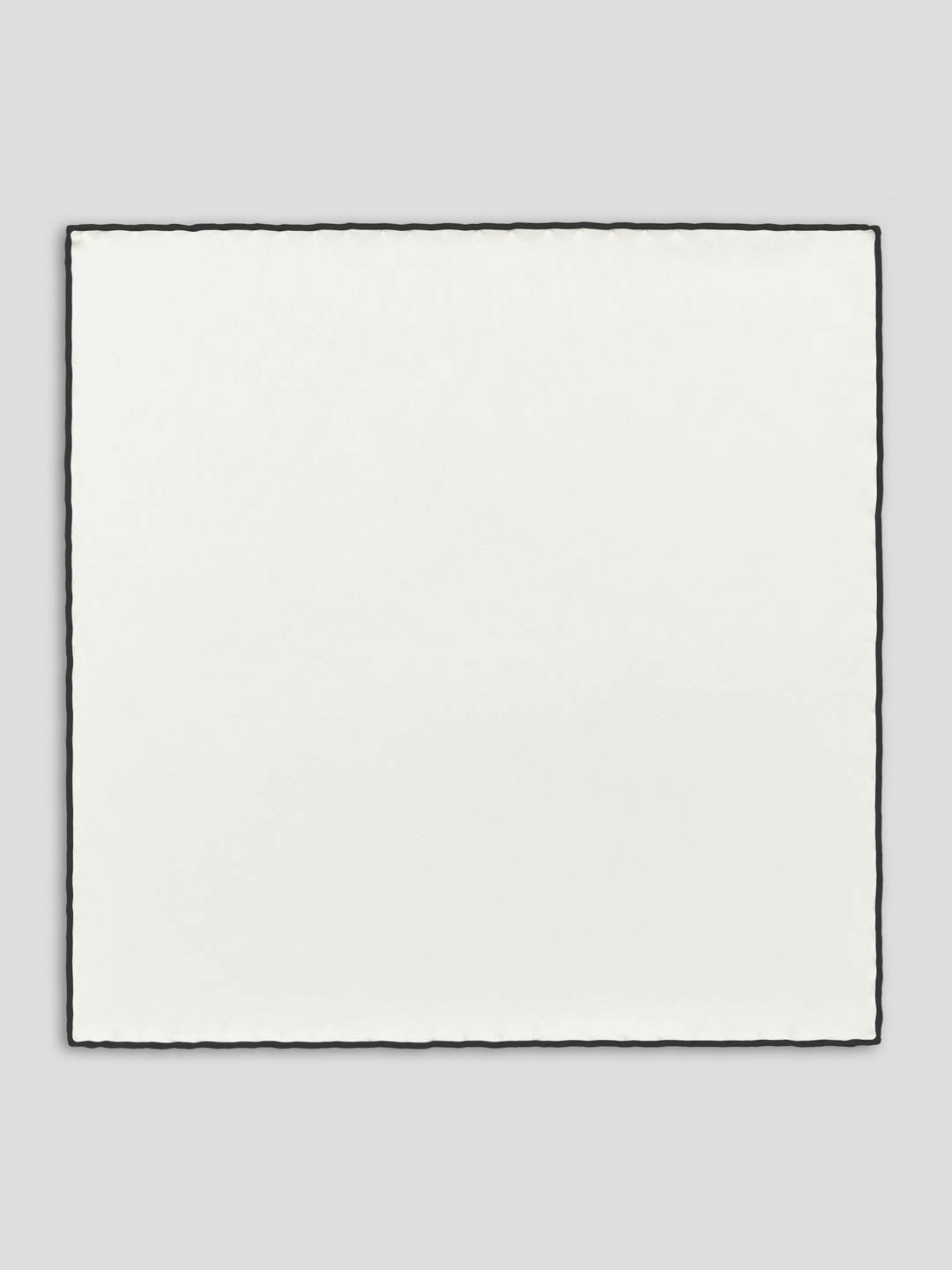 White silk handkerchief with black border.