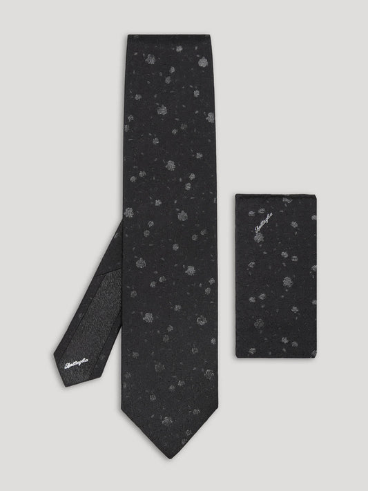 Black silk tie with silver floral details and matching handkerchief.