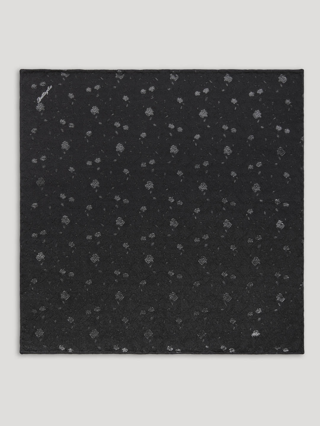 Black silk handkerchief with silver floral details.