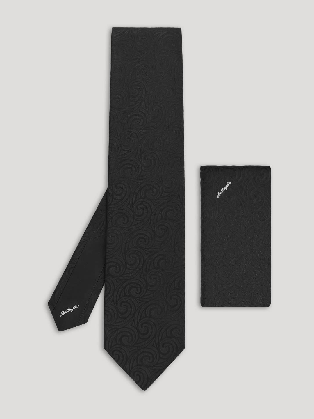 Black tone on tone paisley tie with matching handkerchief.