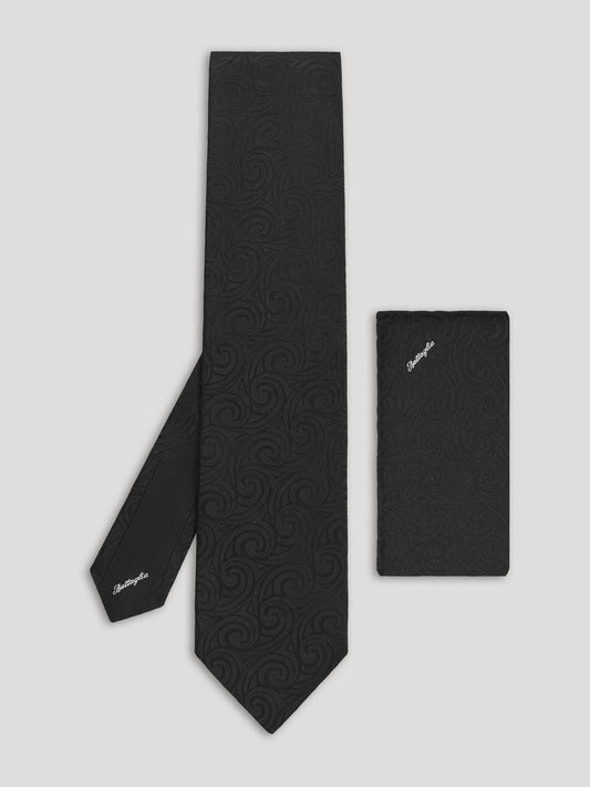 Black tone on tone paisley tie with matching handkerchief.