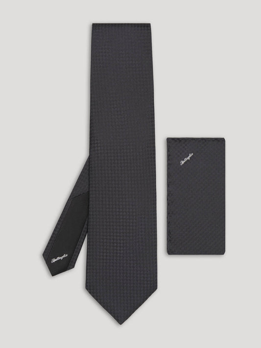 Black tone on tone check pattern silk tie with matching handkerchief.