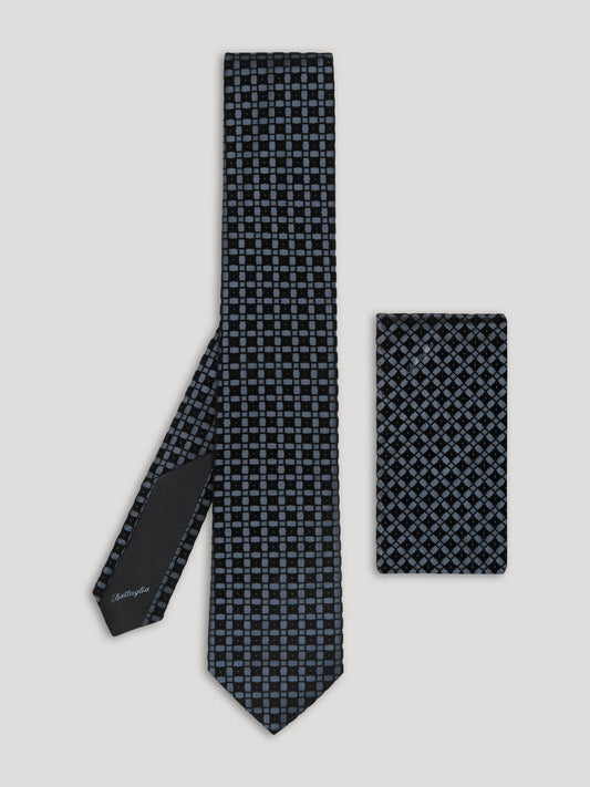 Blue check pattern silk tie with matching handkerchief.