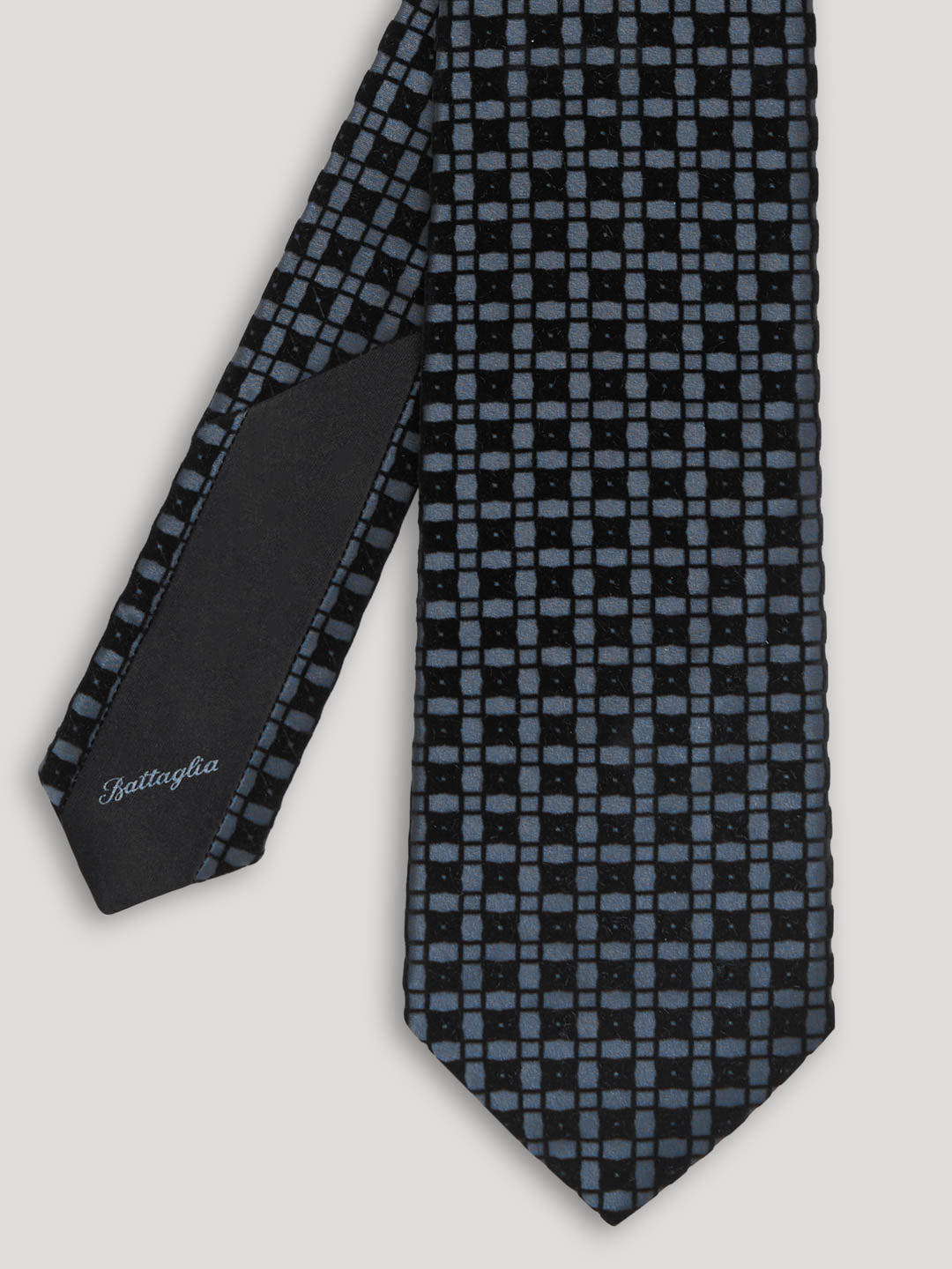 Blue silk tie with check pattern.