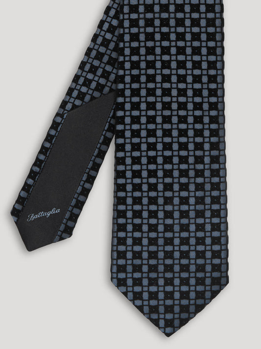 Blue silk tie with check pattern.