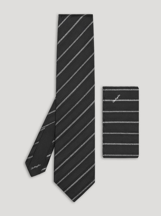 Black silk tie with silver stripes and matching handkerchief.