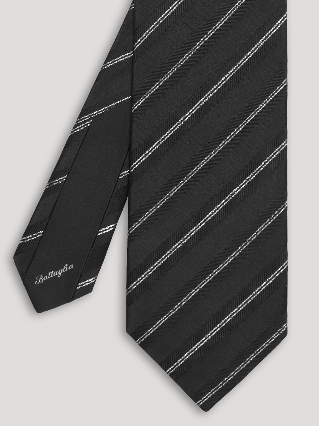 Black silk tie with silver stripes. 