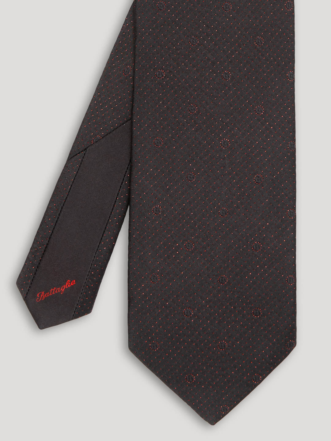 Black tie with red polkadots.
