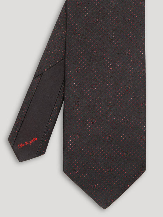 Black tie with red polkadots.