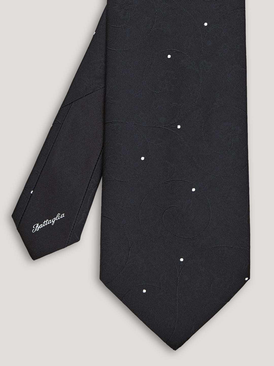 Black floral tie with polkadots.