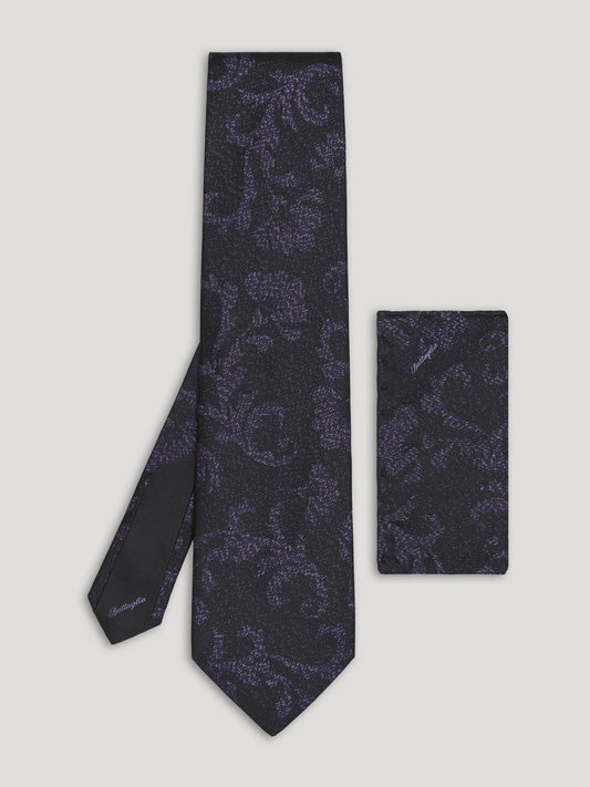 Black tie with floral design and handkerchief.