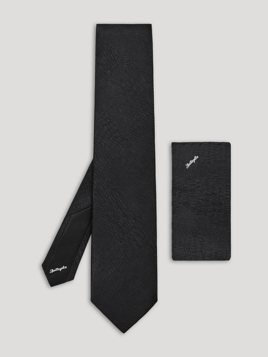 Black tie with black handkerchief.