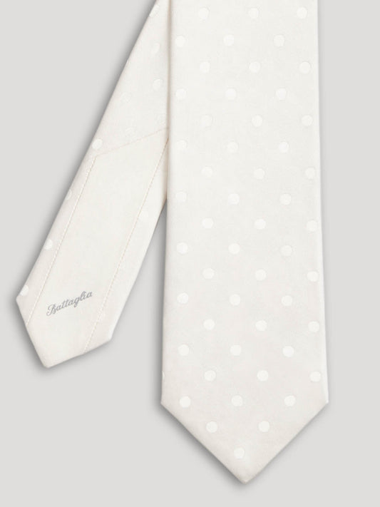 White silk tie with polkadots.