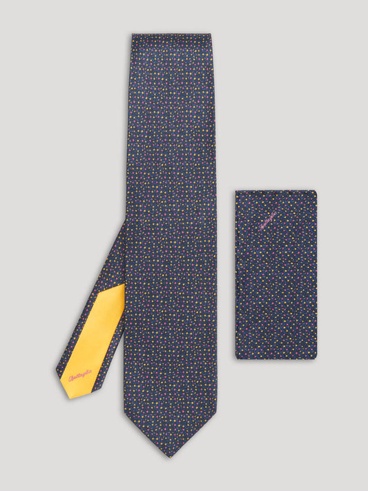 Navy blue floral tie with pink and yellow floral details and matching handkerchief.