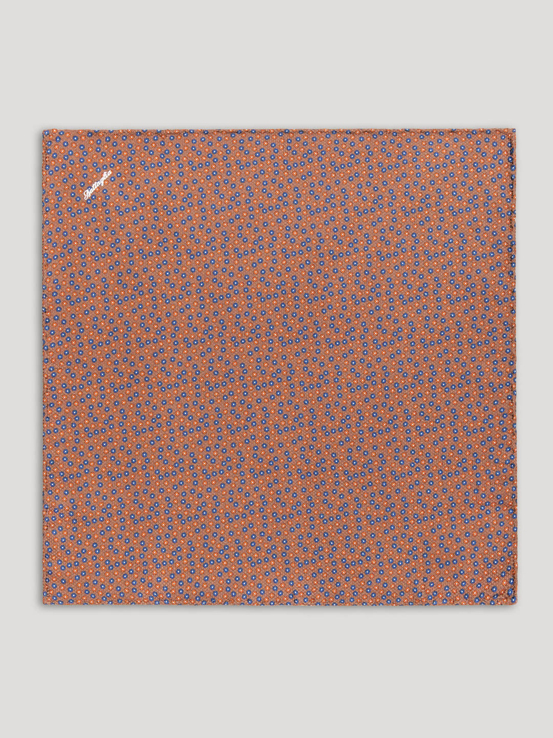 Brown handkerchief with yellow and blue floral details.