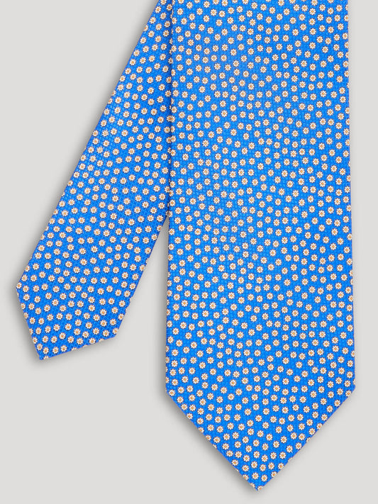 Light blue floral tie with pink and yellow floral details.