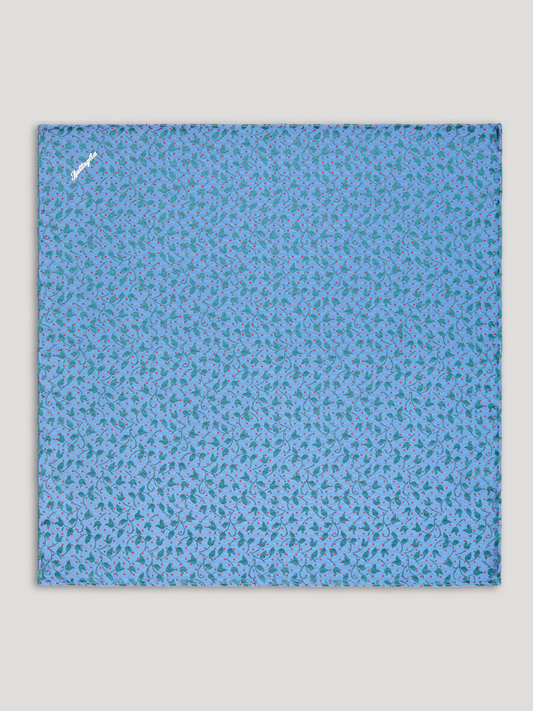Sky blue handkerchief with green and red floral details.