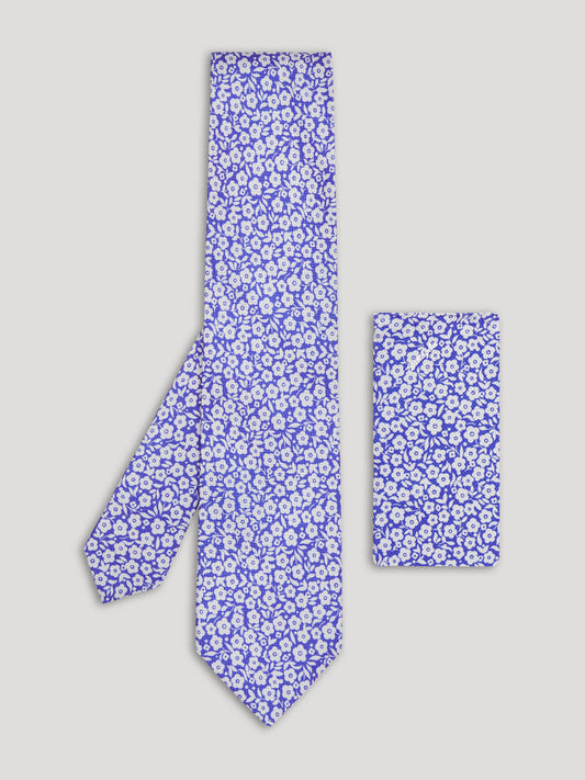 Violet blue tie with silver flowers and matching handkerchief.