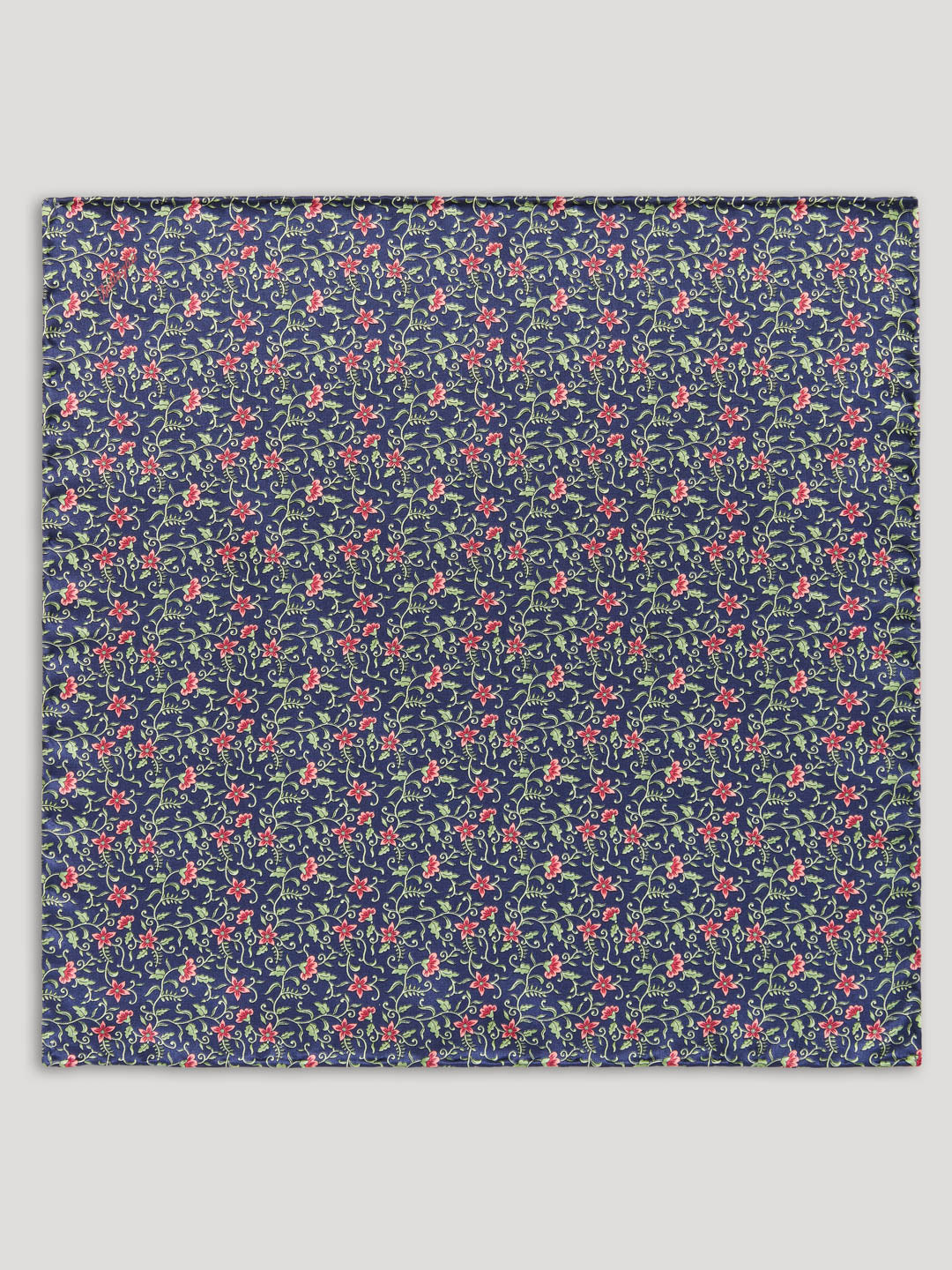 Navy handkerchief with pink and green flowers.
