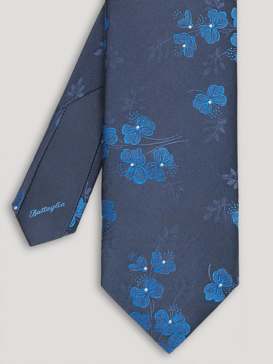 Navy tie with blue woven floral details.
