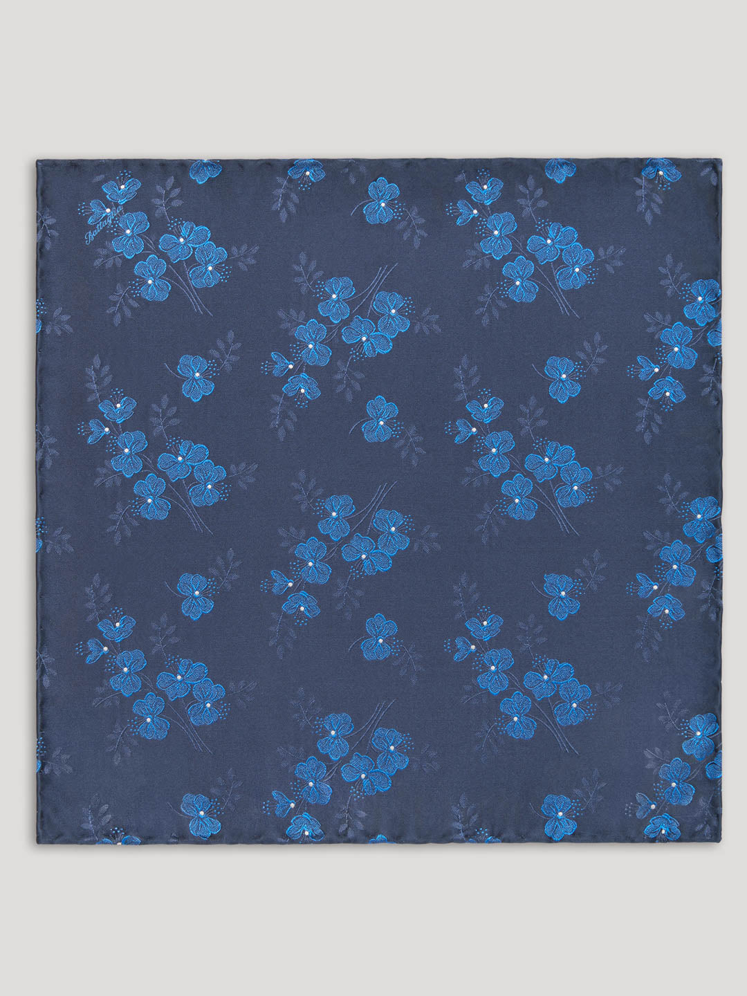 Navy handkerchief with blue woven floral details.