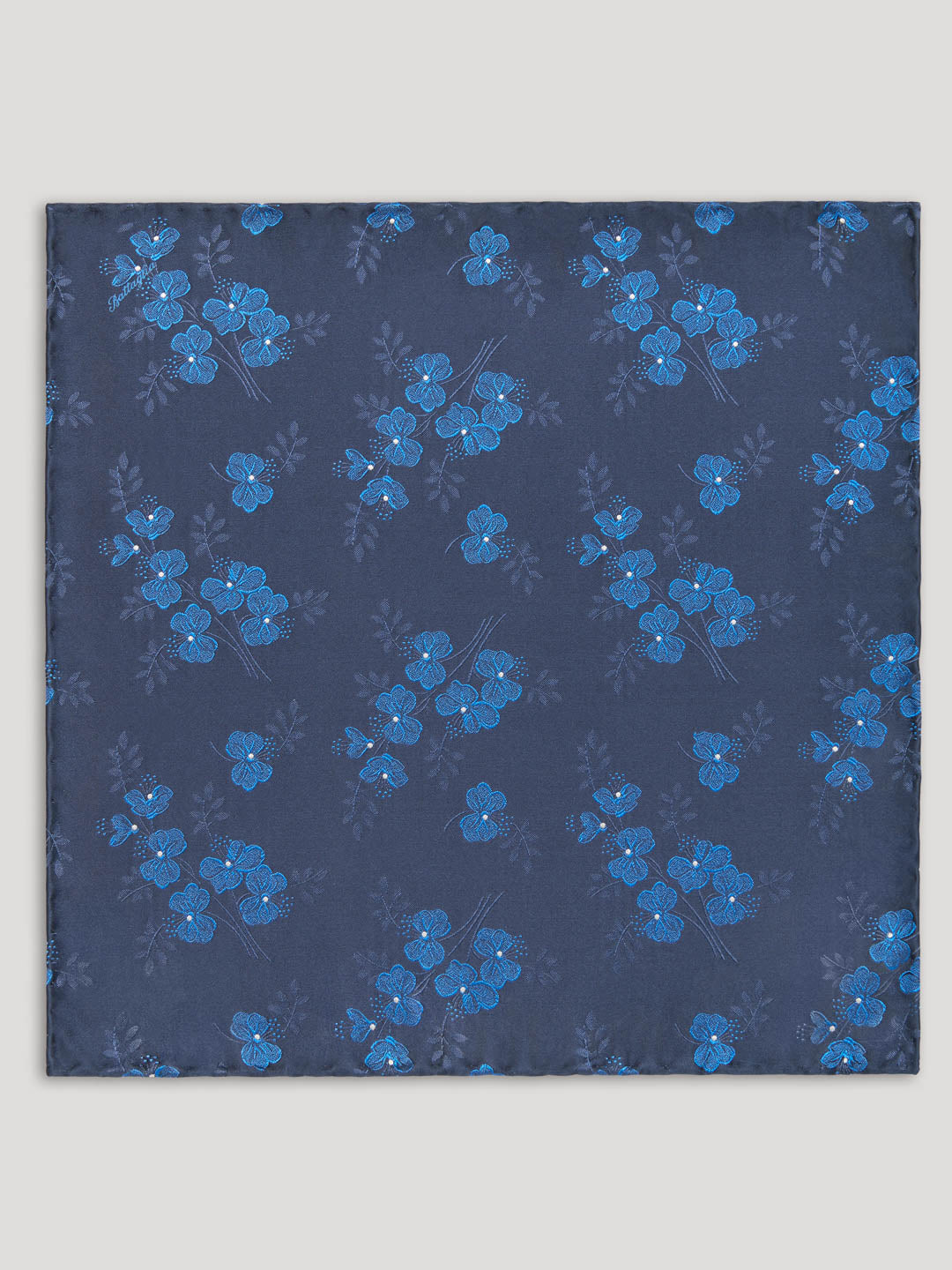 Navy handkerchief with blue woven floral details. 