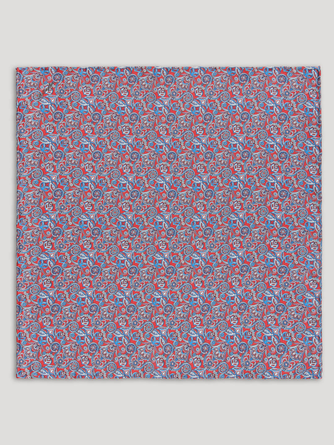 Handkerchief with red and blue floral design.