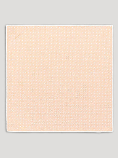 Peach handkerchief with white diamond details. 