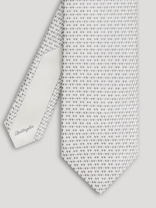 Silver tie with small grey geometric details.