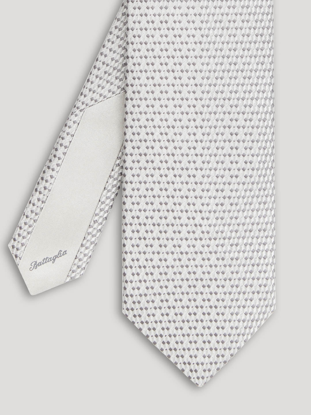 Silver tie with small grey geometric details.