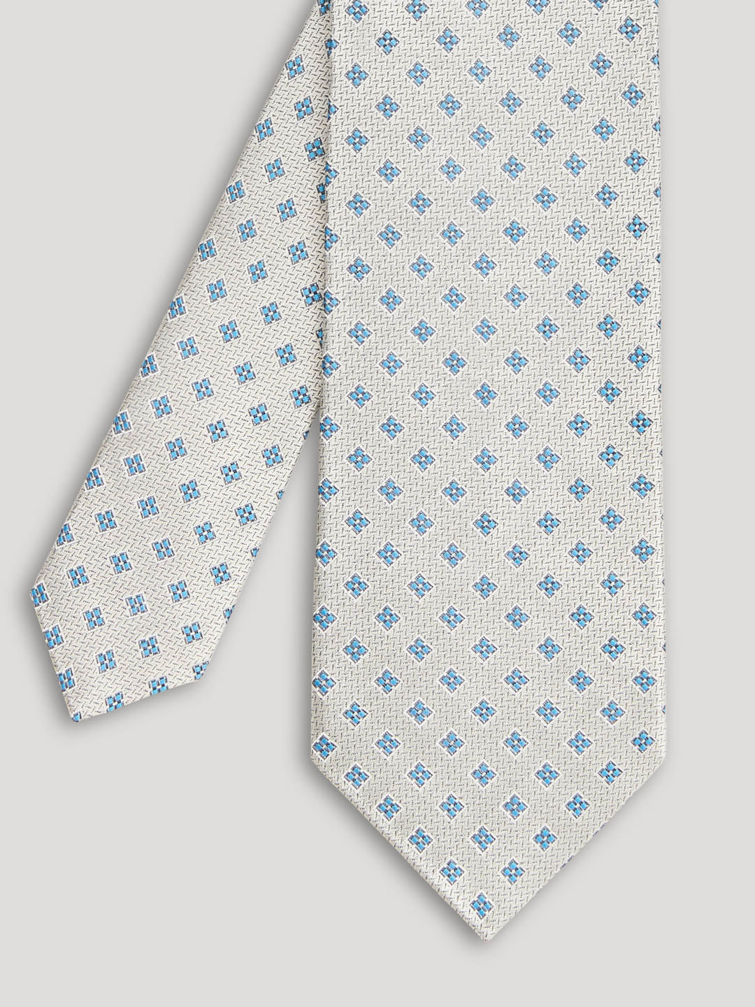Silver tie with blue diamonds. 