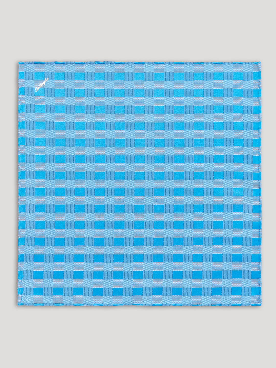 Blue handkerchief with geometric design.