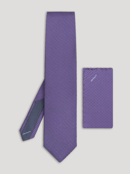 Purple zig zag design tie with matching handkerchief.