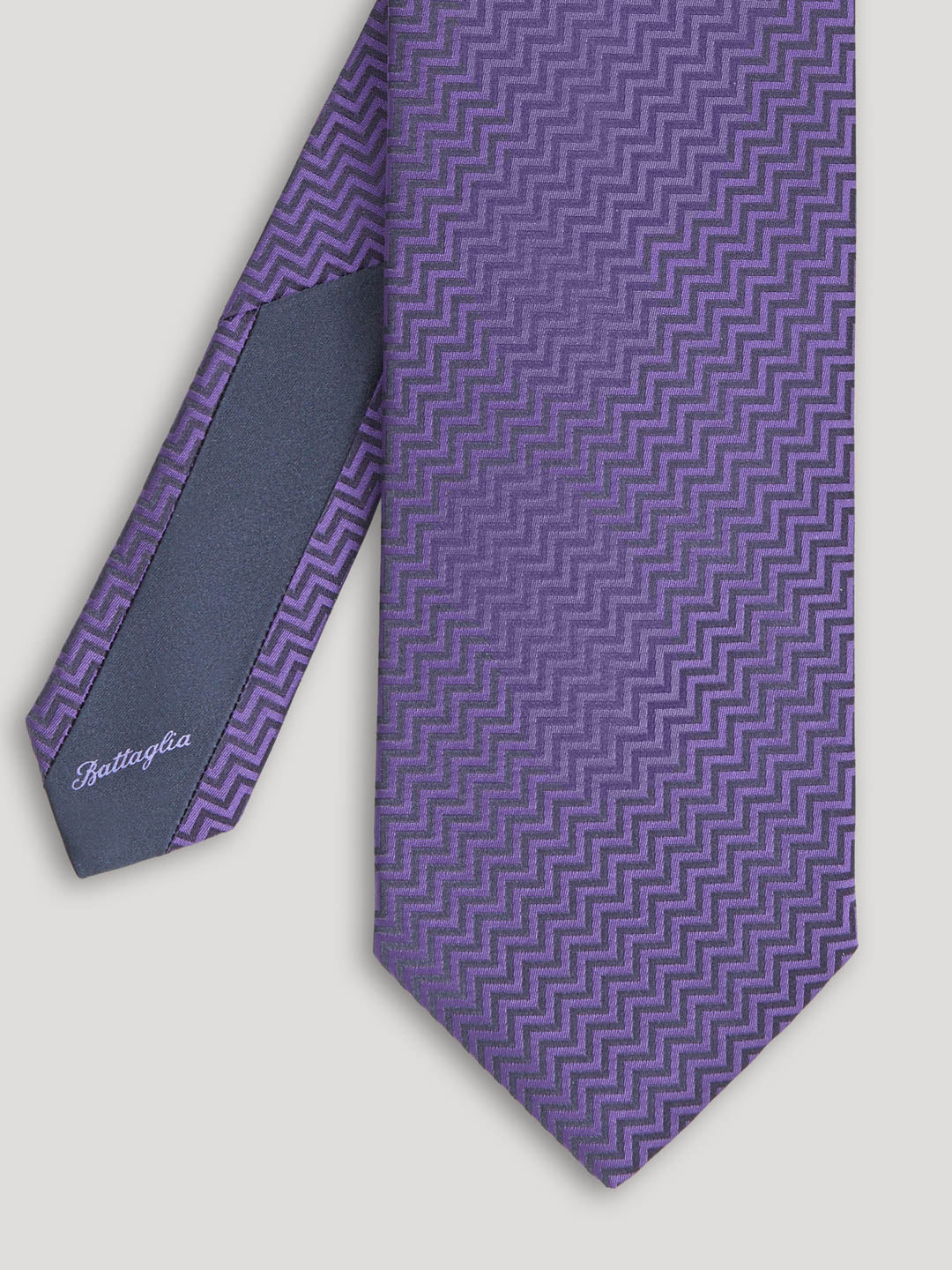 Purple zig zag design tie. 