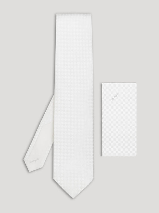 Tone on tone white checkerboard tie with matching handkerchief. 