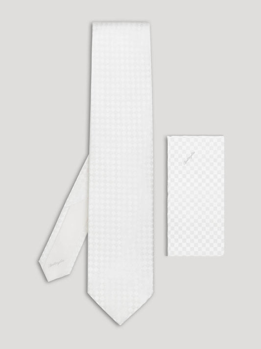 Tone on tone white checkerboard tie with matching handkerchief.