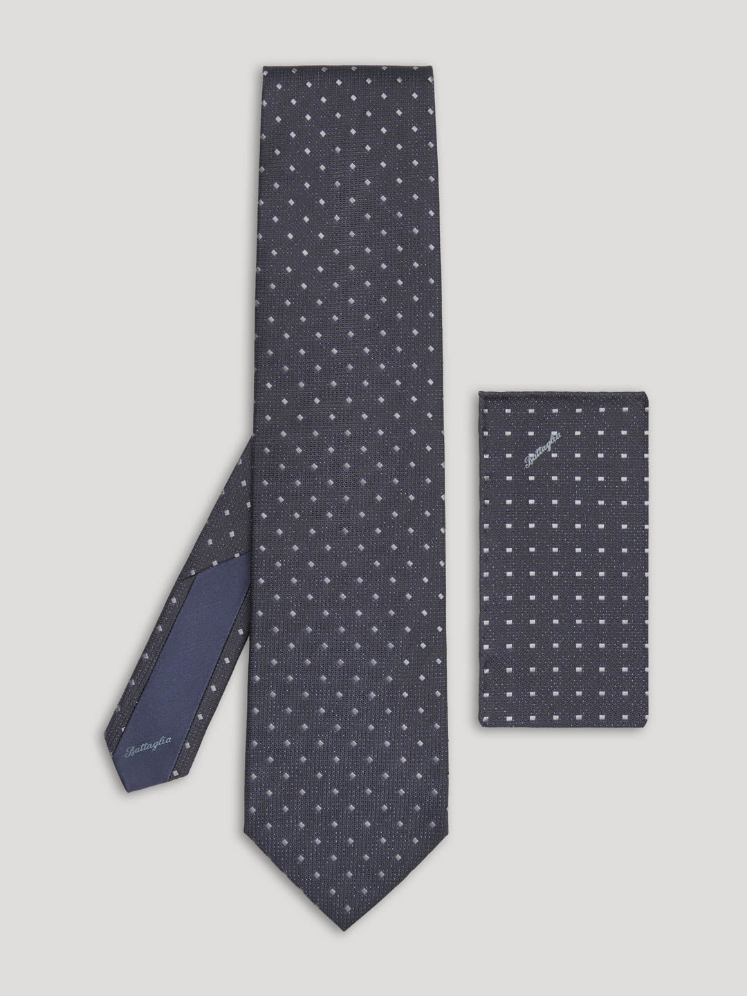 Black tie with small grey diamond design and matching handkerchief.