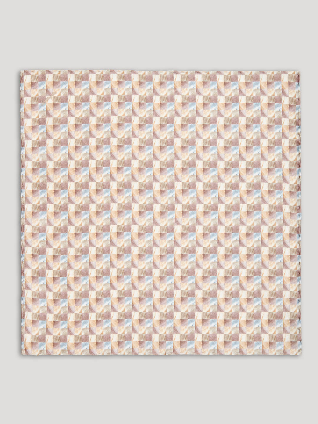 Beige handkerchief with geometric pattern.