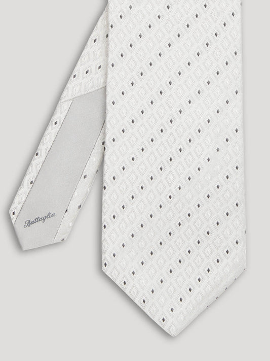 Silver tie with pinpoint geometric design.