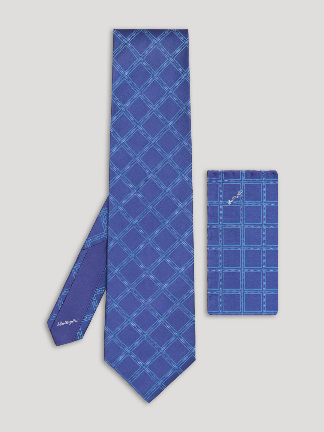 Blue diamond design tie with matching handkerchief.
