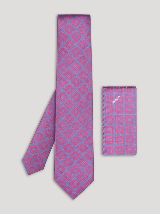 Pink and purple tie with geometric design and matching handkerchief. 