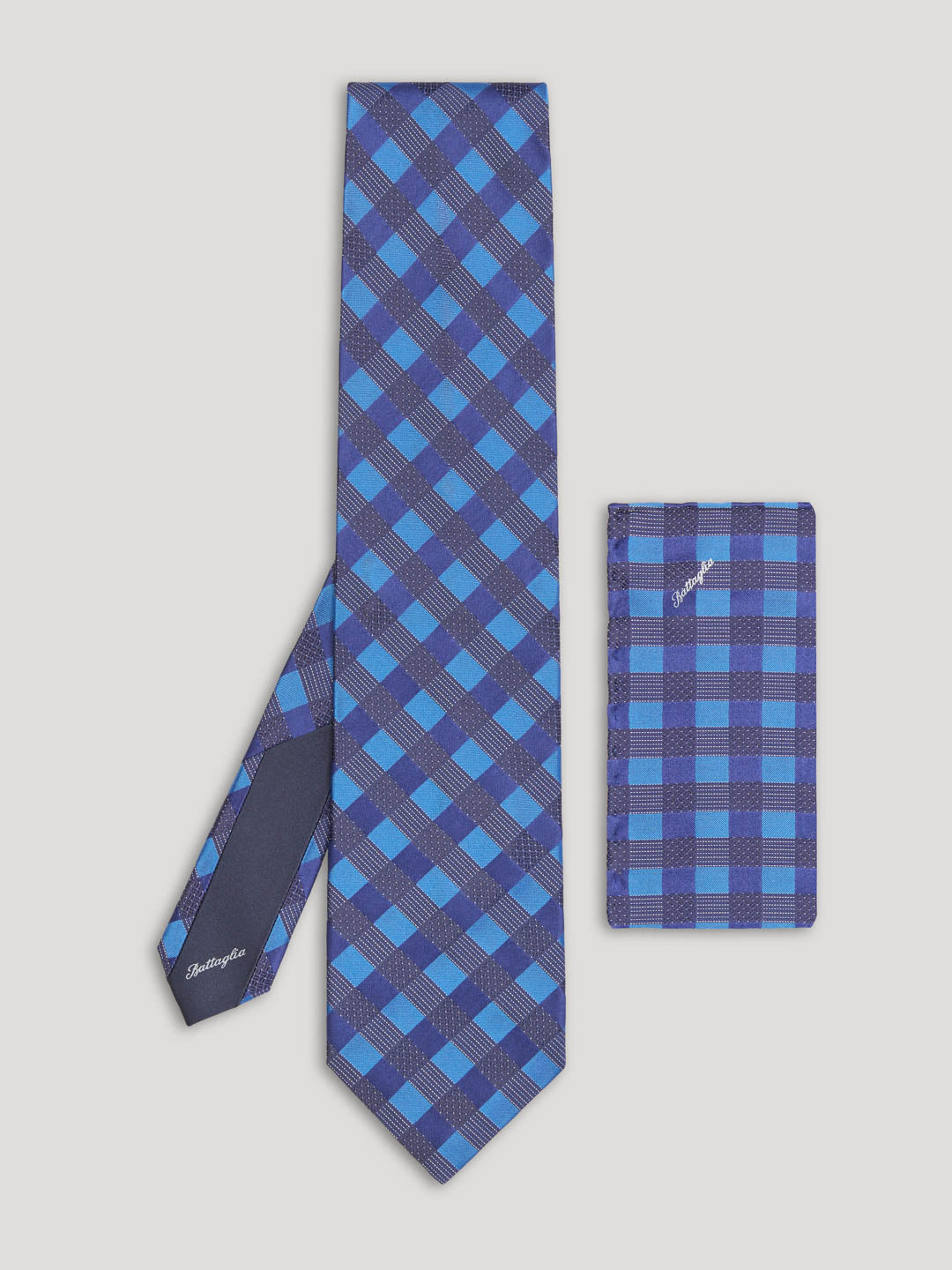 Blue and black geometric design tie and matching handkerchief.