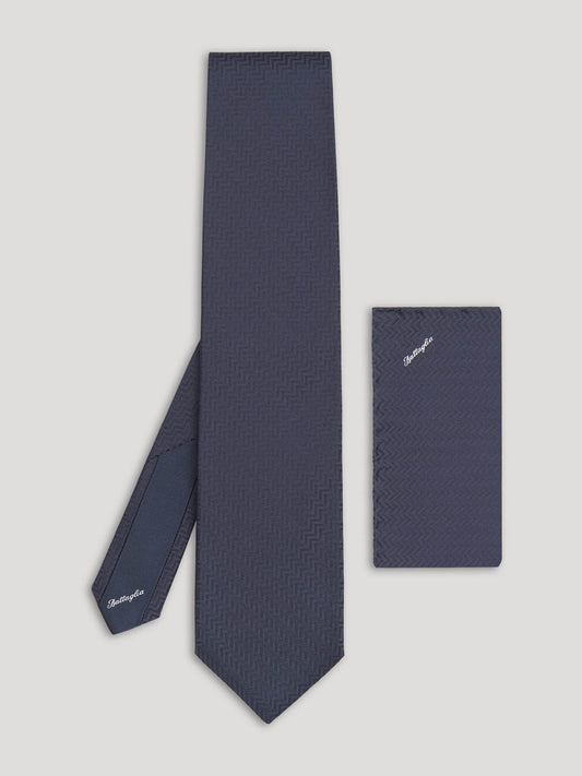 Black tone on tone zig zag design tie with matching handkerchief.