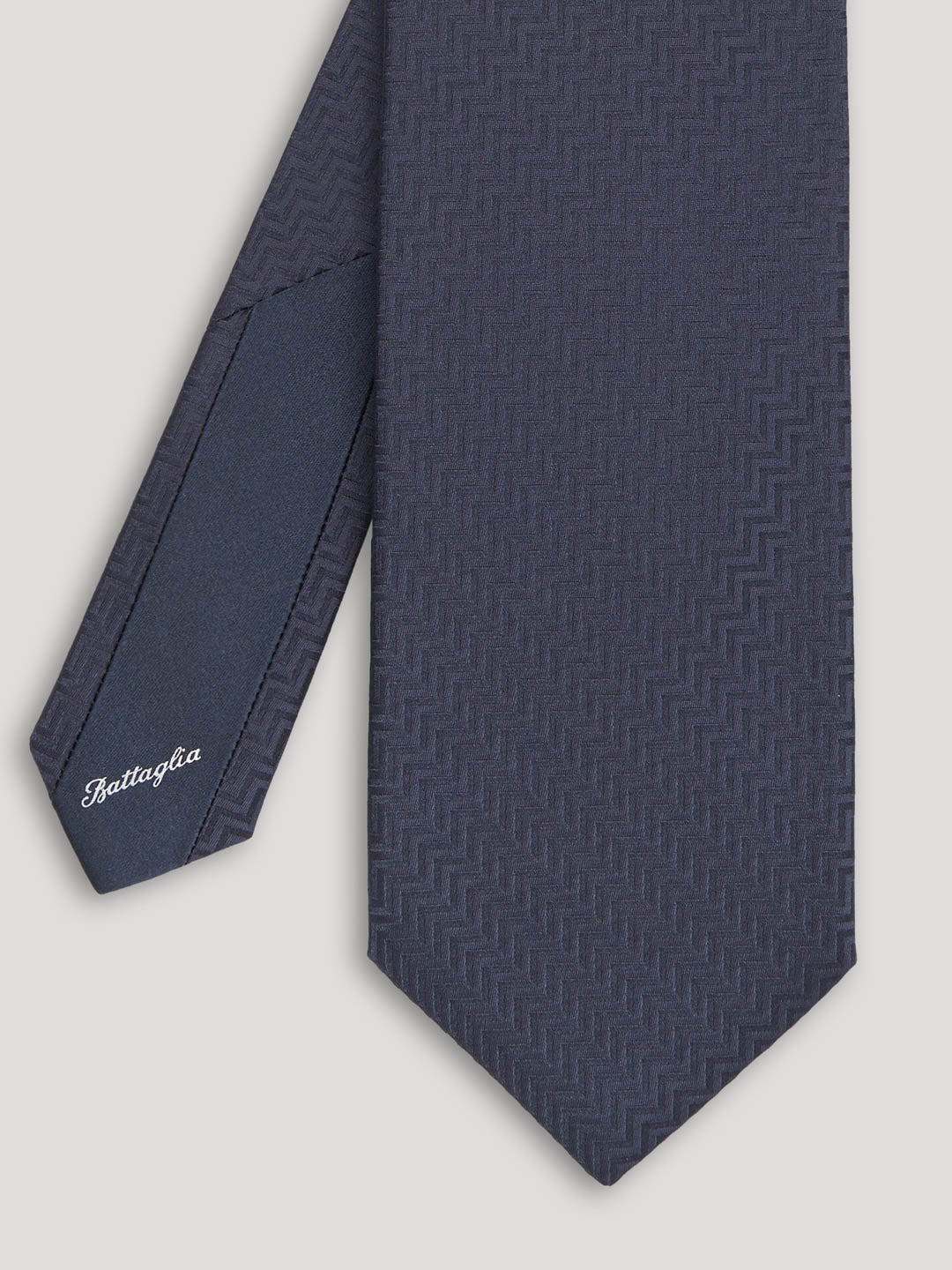 Black tone on tone tie with zig zag design.