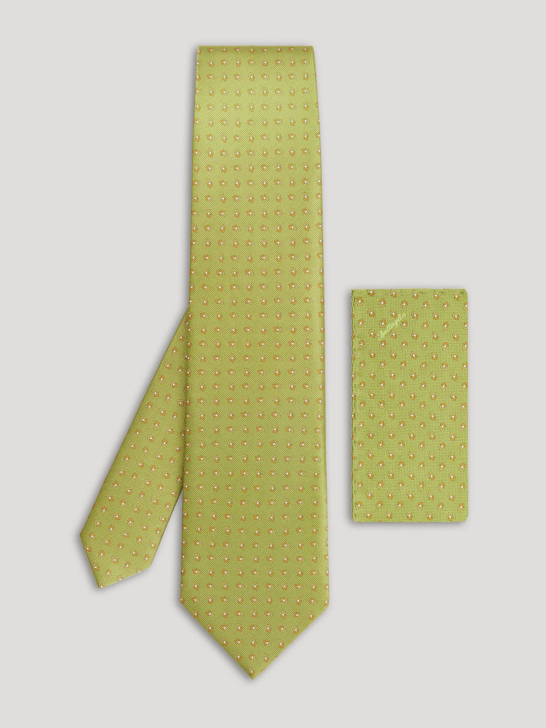 Lime green tie with gold diamond design and matching handkerchief.