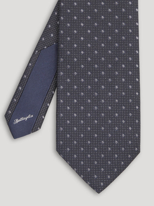Black tie with silver geometric design.
