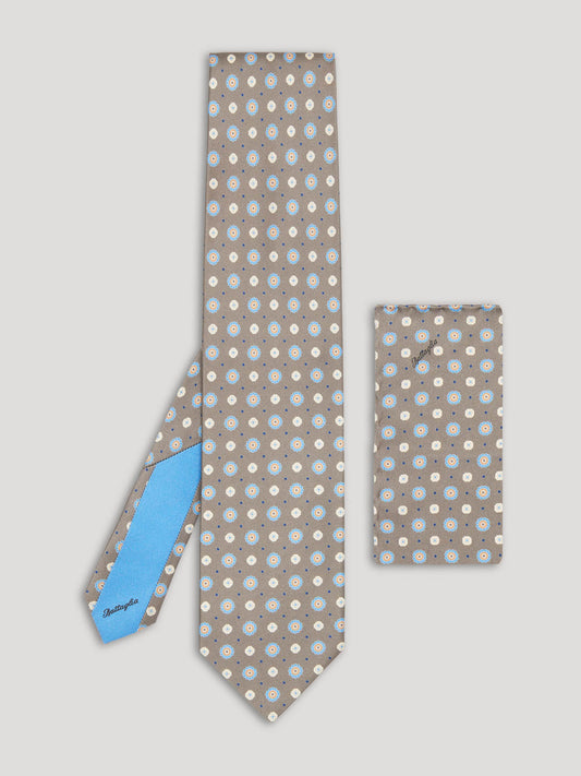 White grey beige and blue tie with large pattern and matching handkerchief