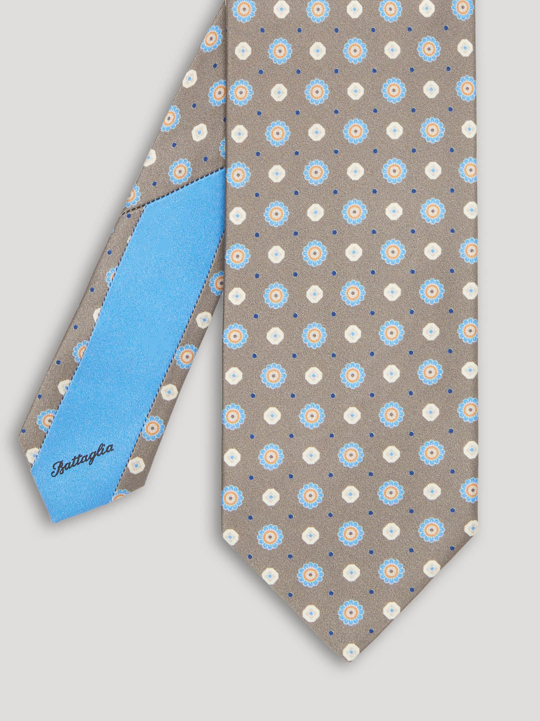 White grey beige and blue tie with large pattern