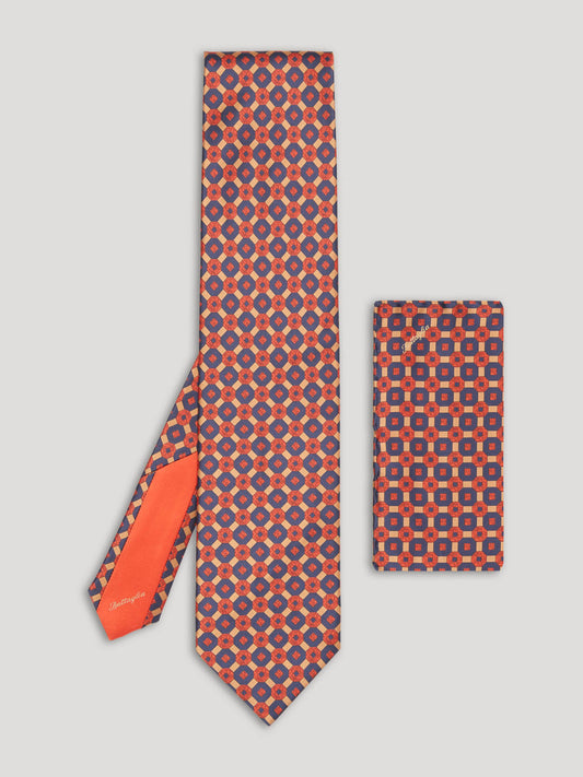 Red, gold and blue tie with large pattern and matching handkerchief