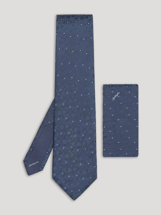 Blue tie with large pattern and matching handkerchief